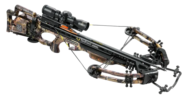 Crossbow types laid out on a workbench beside bolts and a scope in natural light.
