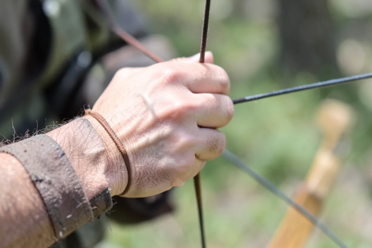 Close-up of a Native American archery finger release on a bowstring