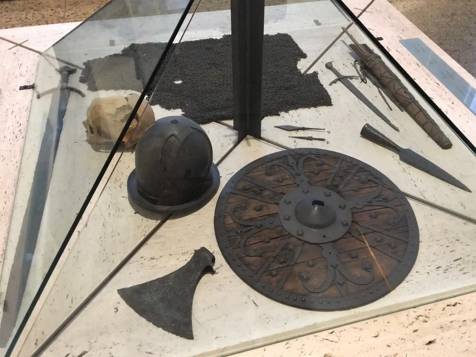 Close-up of a hand checking a Ravin crossbow arrow nock and shaft fit near a crossbow rail