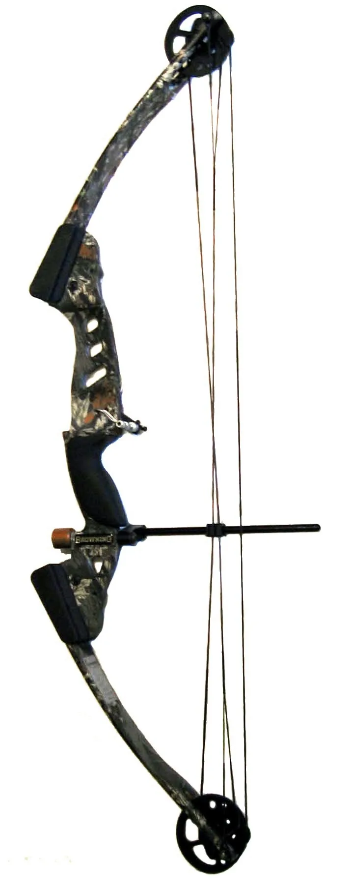 Archery enthusiast holding a Hoyt Torrex compound bow at an outdoor range in natural light.