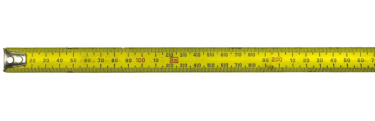 Archer measuring a bow string with a string measuring tape beside a recurve bow